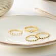 .18 ct. t.w. Sapphire and .13 ct. t.w. Diamond Eternity Band in 14kt Yellow Gold